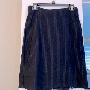 Size 4 Black skirt with beautiful lace triangle design in the back bottom